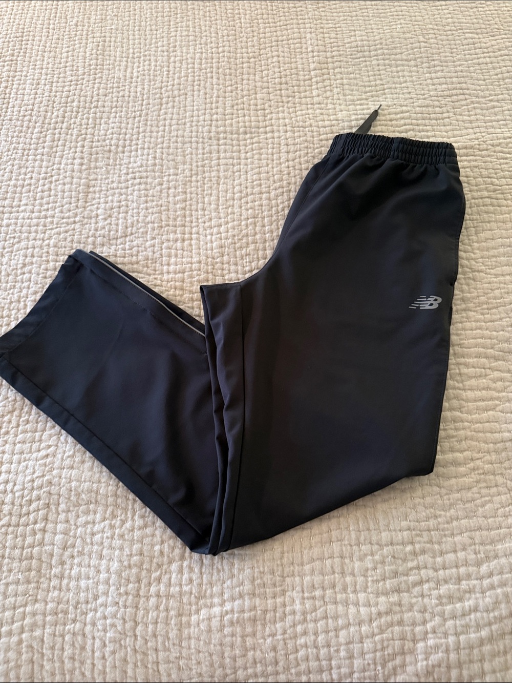 New Balance Black Men's Jogger Pants with Reflective Logo and zippered leg